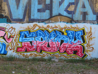 850607 Afbeelding van een graffitikunstwerk met de tekst 'SPUNK' op een muur langs de jongerenplek Teen Spot ('De Kuil ...